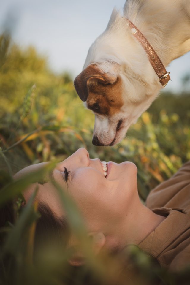 Dog and his lady show love.
